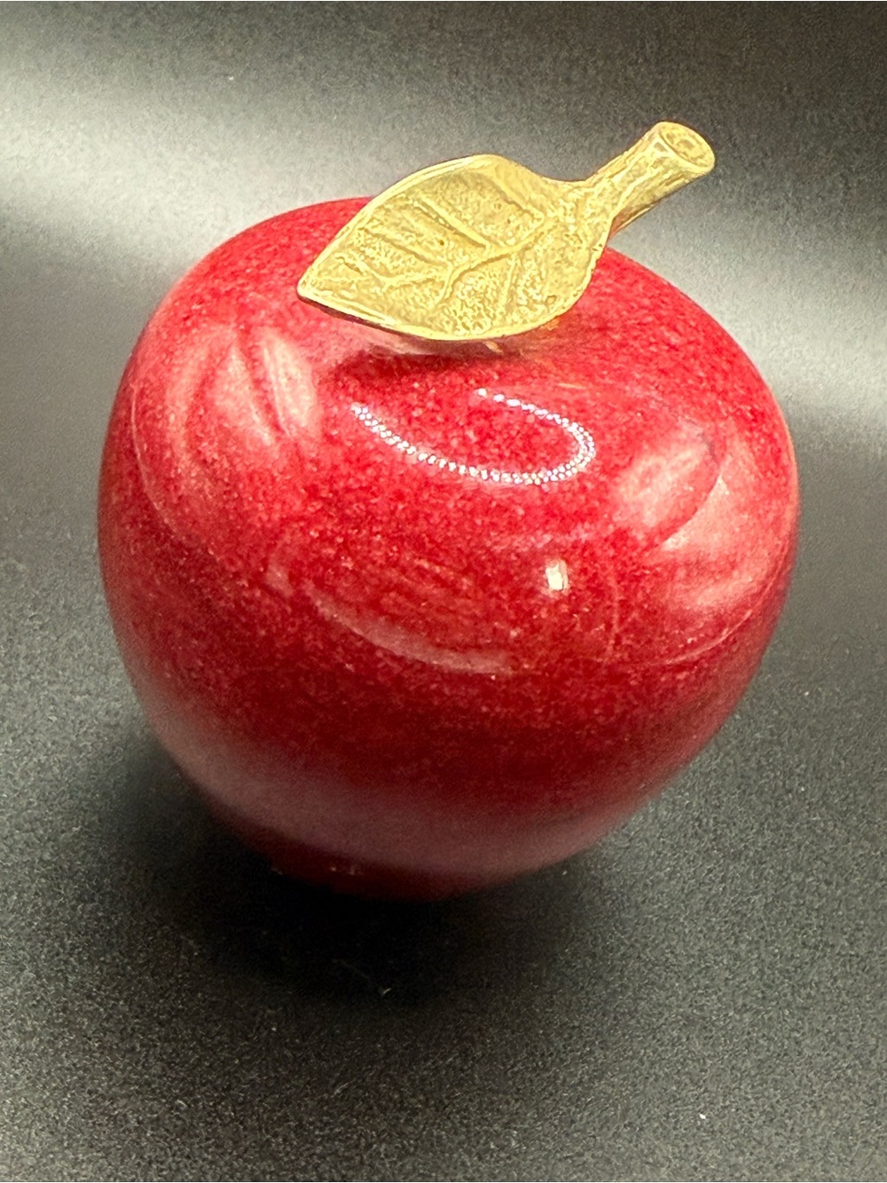 vintage polished red marble or alabaster apple paperweight with a brass stem and